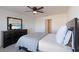Spacious bedroom with full bed and large window at 5462 Logan Cave Ave, Wimauma, FL 33598