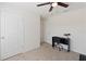 Bright bedroom with a desk and chair, and plenty of space at 5462 Logan Cave Ave, Wimauma, FL 33598