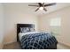 Bedroom with full bed, ceiling fan and dresser at 5462 Logan Cave Ave, Wimauma, FL 33598