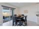 Breakfast nook with table and chairs, view of backyard at 5462 Logan Cave Ave, Wimauma, FL 33598