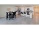 Modern kitchen with breakfast nook and island seating at 5462 Logan Cave Ave, Wimauma, FL 33598