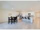 Open concept kitchen with island, stainless steel appliances, and dining area at 5462 Logan Cave Ave, Wimauma, FL 33598