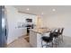 Modern kitchen with stainless steel appliances and granite countertops at 5462 Logan Cave Ave, Wimauma, FL 33598