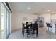 Kitchen with breakfast nook and sliding glass doors to backyard at 5462 Logan Cave Ave, Wimauma, FL 33598