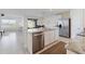 Modern kitchen with island, stainless steel appliances, and granite countertops at 5462 Logan Cave Ave, Wimauma, FL 33598