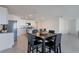 Modern kitchen with island, stainless steel appliances, and granite countertops at 5462 Logan Cave Ave, Wimauma, FL 33598