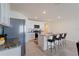 Modern kitchen with stainless steel appliances and granite countertops at 5462 Logan Cave Ave, Wimauma, FL 33598