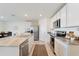 Modern kitchen with stainless steel appliances and granite countertops at 5462 Logan Cave Ave, Wimauma, FL 33598