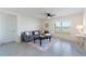 Living room with gray sectional sofa, coffee table, and large window at 5462 Logan Cave Ave, Wimauma, FL 33598