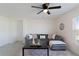 Cozy living room featuring a sectional sofa, coffee table, and decorative pillows at 5462 Logan Cave Ave, Wimauma, FL 33598