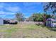 Spacious backyard with a shed and wooden fence at 5836 8Th St, Zephyrhills, FL 33542