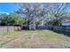 Large backyard with shed and wooden fence at 5836 8Th St, Zephyrhills, FL 33542