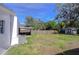 Large backyard with shed and wooden fence at 5836 8Th St, Zephyrhills, FL 33542
