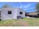 House exterior showcasing backyard with patio, shed, and fence at 5836 8Th St, Zephyrhills, FL 33542