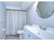 Clean bathroom with white vanity and shower/tub at 5836 8Th St, Zephyrhills, FL 33542