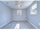 Simple bedroom with ceiling fan and window at 5836 8Th St, Zephyrhills, FL 33542