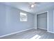 Bedroom with ceiling fan, window, and closet at 5836 8Th St, Zephyrhills, FL 33542
