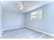Spacious bedroom with light grey walls and vinyl flooring at 5836 8Th St, Zephyrhills, FL 33542