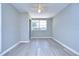 Bright bedroom with ceiling fan and window at 5836 8Th St, Zephyrhills, FL 33542