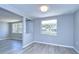 Bright dining area with gray walls and wood-look floors at 5836 8Th St, Zephyrhills, FL 33542