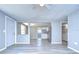 Bright and airy living room with light gray walls and wood-look flooring at 5836 8Th St, Zephyrhills, FL 33542