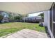 Covered patio in backyard offering shaded outdoor space at 5836 8Th St, Zephyrhills, FL 33542