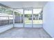 Screened porch with access to the backyard at 5836 8Th St, Zephyrhills, FL 33542