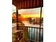 Sunset view from a screened balcony overlooking a lake at 6188 80Th N St # 402, St Petersburg, FL 33709
