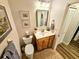 Guest bathroom with wood vanity and tile floor at 6188 80Th N St # 402, St Petersburg, FL 33709