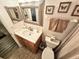 Bright bathroom with sink, toilet and decorative accents at 6188 80Th N St # 402, St Petersburg, FL 33709