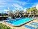 Inviting community pool with lounge chairs at 6188 80Th N St # 402, St Petersburg, FL 33709