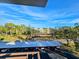 Sunny view of community with lush landscaping and parking at 6188 80Th N St # 402, St Petersburg, FL 33709
