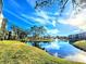 Scenic lakefront property with lush landscaping and a tranquil atmosphere at 6188 80Th N St # 402, St Petersburg, FL 33709