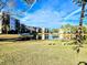 Peaceful lakefront view of community buildings at 6188 80Th N St # 402, St Petersburg, FL 33709