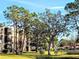 Landscaped grounds with mature trees and building at 6188 80Th N St # 402, St Petersburg, FL 33709