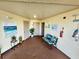 Building hallway with seating and nautical art at 6188 80Th N St # 402, St Petersburg, FL 33709