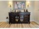 Dark wood wet bar with ample storage and artwork at 6188 80Th N St # 402, St Petersburg, FL 33709