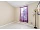 Small bedroom with window and floor lamp at 6333 Osprey Lake Cir, Riverview, FL 33578