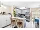 Modern kitchen with stainless steel appliances and breakfast bar at 6333 Osprey Lake Cir, Riverview, FL 33578