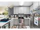 Modern kitchen with stainless steel appliances and white cabinets at 6333 Osprey Lake Cir, Riverview, FL 33578