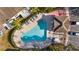 Community pool with lounge chairs and shaded areas at 6333 Osprey Lake Cir, Riverview, FL 33578