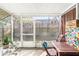 Screened patio with table and chairs at 6333 Osprey Lake Cir, Riverview, FL 33578