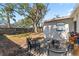 Spacious backyard with large tree and patio at 6811 S Hesperides St, Tampa, FL 33616