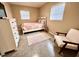 Cozy bedroom with a double bed and a comfortable armchair at 6811 S Hesperides St, Tampa, FL 33616