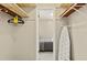 Bedroom closet with shelving and an ironing board at 6811 S Hesperides St, Tampa, FL 33616