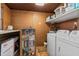 Bright laundry room with washer and dryer at 6811 S Hesperides St, Tampa, FL 33616