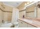 Updated bathroom with a tub, shower, and vanity at 7200 Ulmerton Rd # E3, Largo, FL 33771
