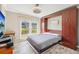 Main bedroom with a murphy bed and built in wardrobe at 7200 Ulmerton Rd # E3, Largo, FL 33771