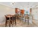 Kitchen features a dining area with table and chairs at 7200 Ulmerton Rd # E3, Largo, FL 33771