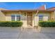 Inviting condo exterior featuring a well-maintained front entrance and landscaping at 7200 Ulmerton Rd # E3, Largo, FL 33771